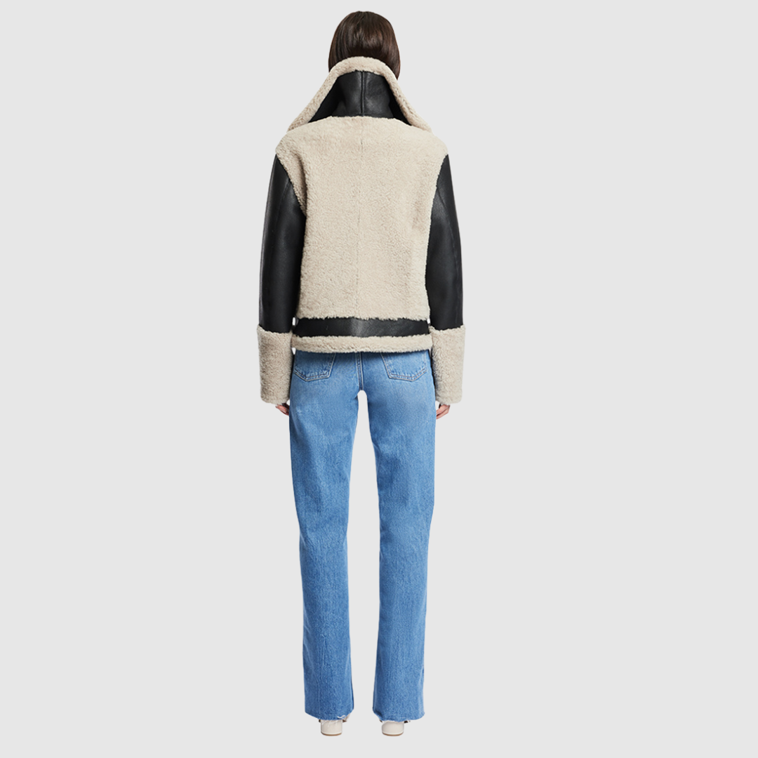 Nappa curly wool shearling Sleek nappa moto Drop shoulder Curly wool detail on body and sleeve cuff Curly wool collar with double buckle detail Asymmetrical front zip closure Side and interior zip pocket
