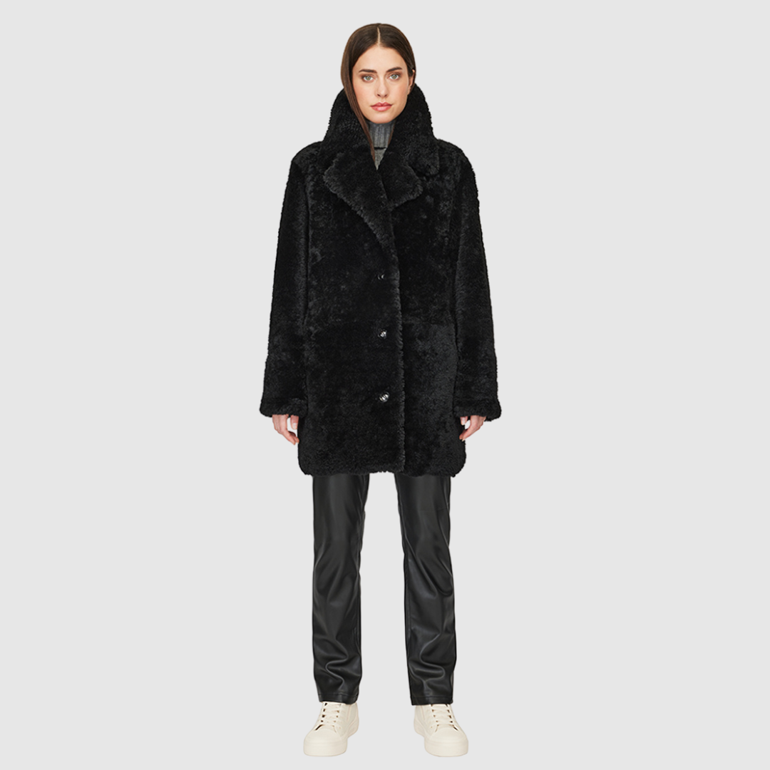 Oversized medium length teddy Oversized notched collar Drop shoulder Single breasted 3 button closure Exterior slash pockets Fully lined