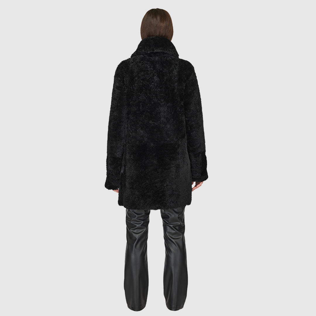 Oversized medium length teddy Oversized notched collar Drop shoulder Single breasted 3 button closure Exterior slash pockets Fully lined