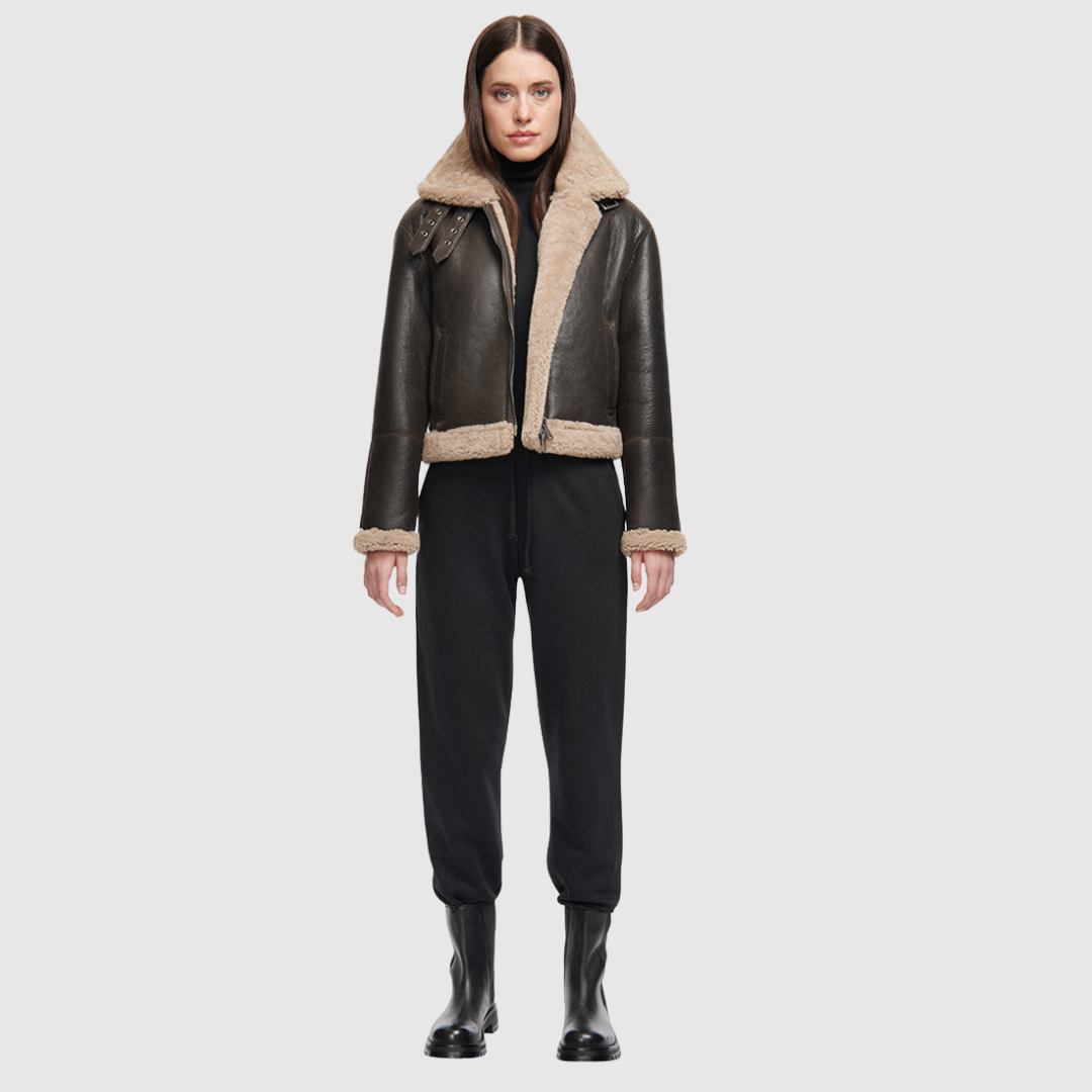 Nappa cropped moto Regular shoulder Curly wool collar and trims Double buckle detail on collar Straight fit through torso Exterior slash side pockets Interior zip pocket Front zip closure