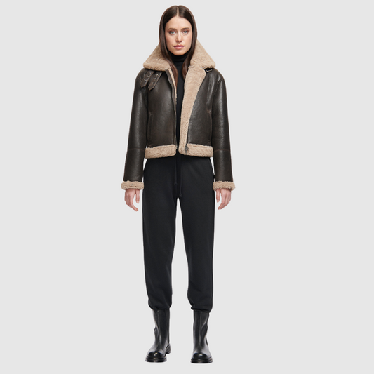 Nappa cropped moto Regular shoulder Curly wool collar and trims Double buckle detail on collar Straight fit through torso Exterior slash side pockets Interior zip pocket Front zip closure