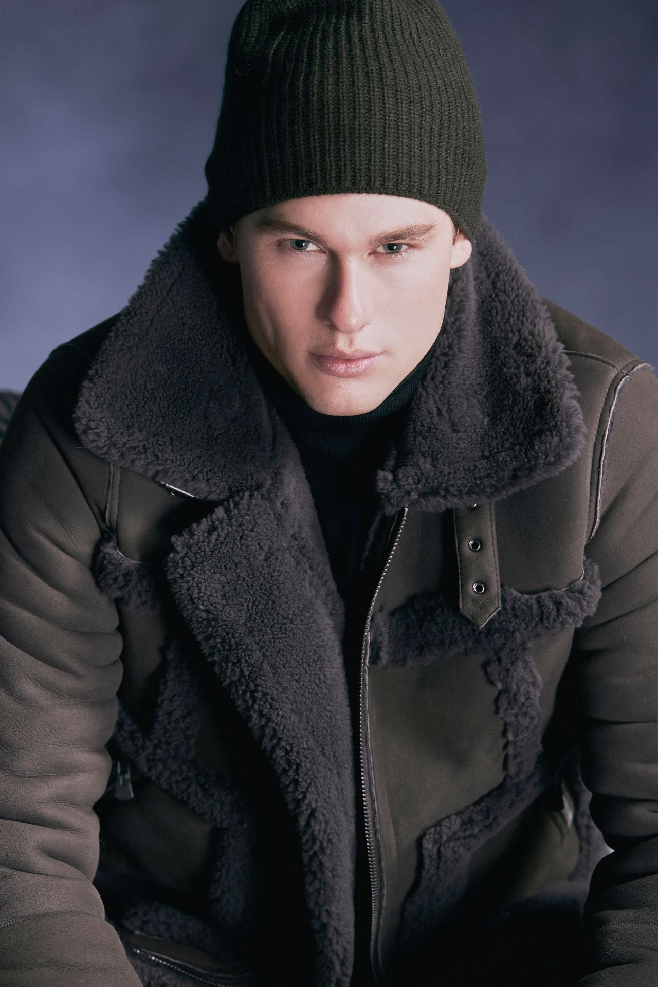 Discover Umberto, our designer mens shearling moto jacket with contrast curly wool out detail. True to size and featuring a standard zip closure, it exudes urban sophistication. With a spread collar adorned with a moto buckle and an interior zip pocket, this jacket combines style and functionality for the perfect winter statement.