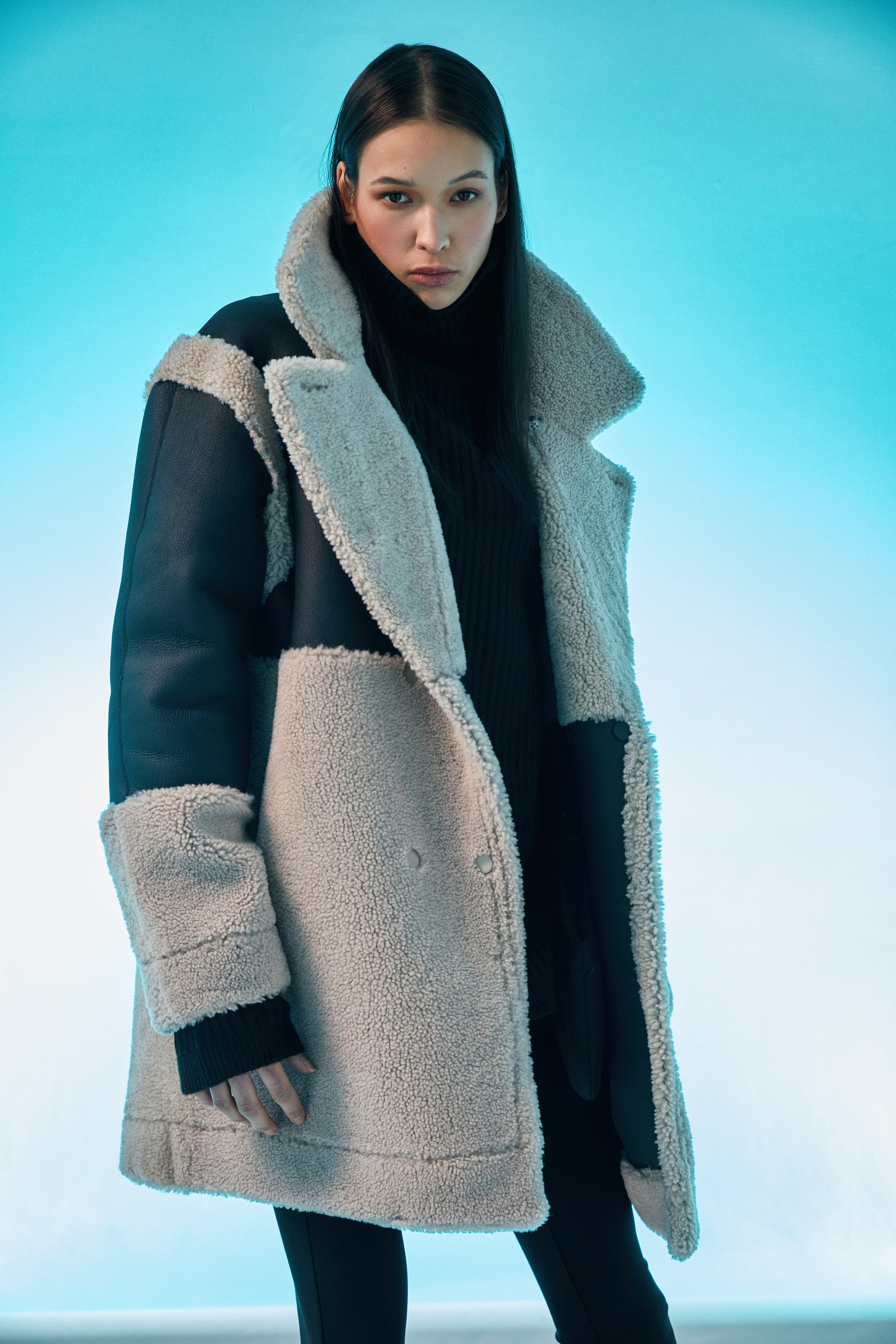 Urban: 33in long. This coat blends the most current fashion Color trends with a timeless style to keep cold winter's bite at bay. Made from the finest Spanish Merino shearling available, this premium coat is comfortable, soft and exceptionally warm. Consistent with key fashion trends it boasts an oversized loose fitted style, has wide sleeves and is straight cut through torso. 
