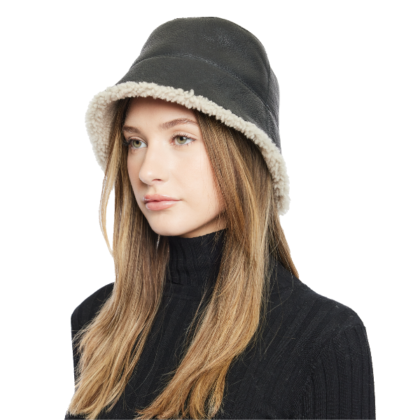 Elevate your winter look with our reversible shearling bucket hat, featuring black nappa leather on one side and beige curly wool on the other. This designer accessory offers versatility, warmth, and style. Stay cozy and chic all season long with this premium addition to your cold-weather wardrobe.