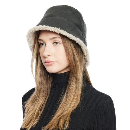 Elevate your winter look with our reversible shearling bucket hat, featuring black nappa leather on one side and beige curly wool on the other. This designer accessory offers versatility, warmth, and style. Stay cozy and chic all season long with this premium addition to your cold-weather wardrobe.