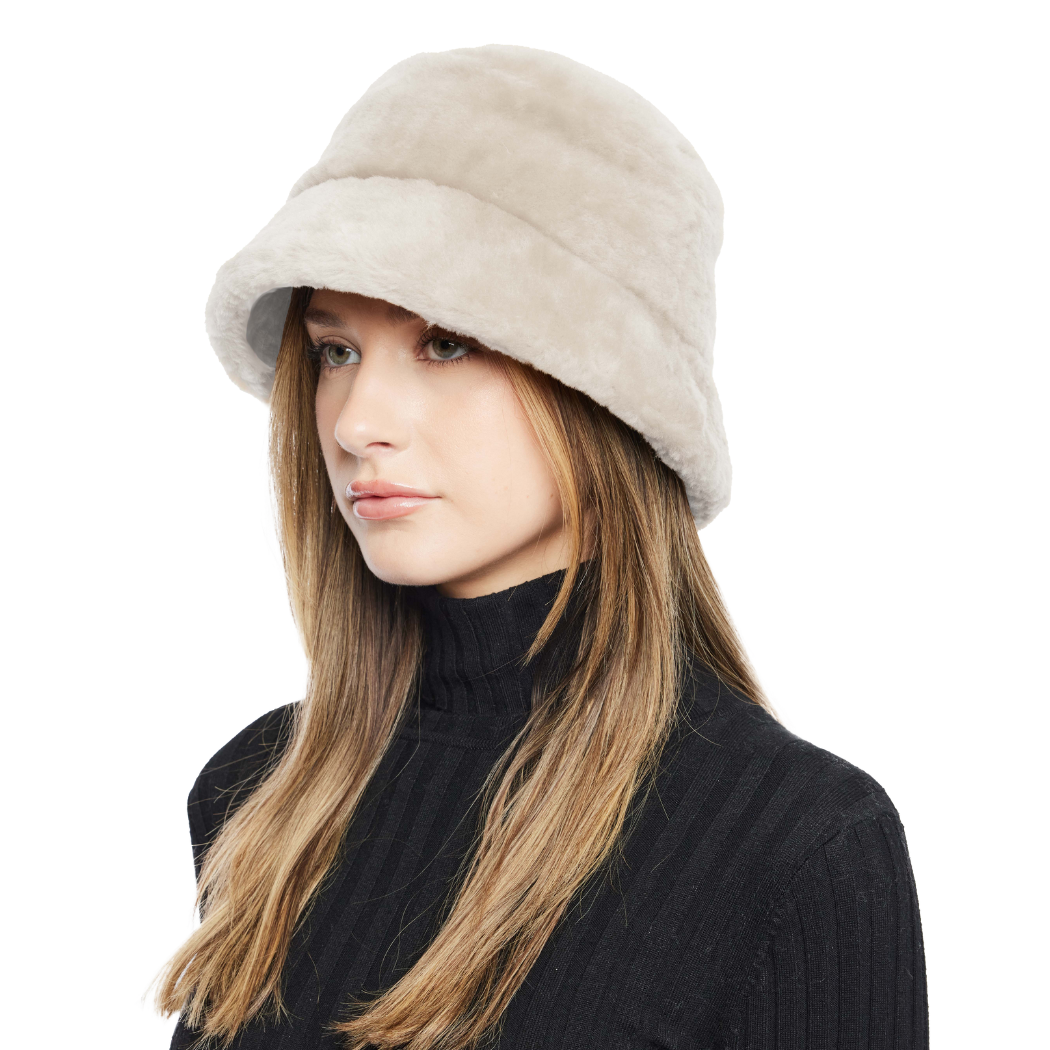 Elevate your winter look with our Cement Shearling Bucket Hat. Featuring an ironed wool exterior, inner brim, and full lining, this designer accessory offers both style and warmth. Embrace premium quality and sophisticated design for cold-weather fashion. Stay cozy and chic all season long with this luxurious addition to your wardrobe.