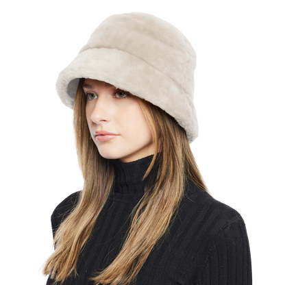 Elevate your winter look with our Cement Shearling Bucket Hat. Featuring an ironed wool exterior, inner brim, and full lining, this designer accessory offers both style and warmth. Embrace premium quality and sophisticated design for cold-weather fashion. Stay cozy and chic all season long with this luxurious addition to your wardrobe.