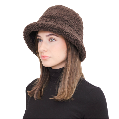 Elevate your winter style with our reversible Chestnut/Black Shearling Curly Wool Bucket Hat. Crafted from luxurious shearling and nylon with topstitching, this designer accessory offers versatility and warmth. Embrace premium quality and sophistication while staying cozy in chilly weather. A must-have addition to your cold-weather wardrobe.