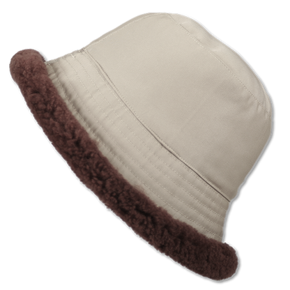 Elevate your winter style with our reversible chocolate/beige shearling curly wool bucket hat, featuring a versatile design that flips to nylon with topstitching. Crafted with premium materials, this designer accessory offers warmth, comfort, and sophistication. Stay cozy and chic all season long with this essential addition to your cold-weather wardrobe.