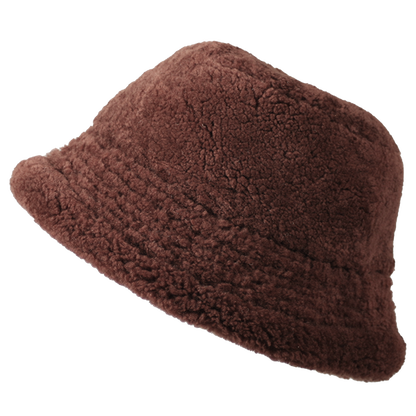 Elevate your winter style with our reversible chocolate/beige shearling curly wool bucket hat, featuring a versatile design that flips to nylon with topstitching. Crafted with premium materials, this designer accessory offers warmth, comfort, and sophistication. Stay cozy and chic all season long with this essential addition to your cold-weather wardrobe.