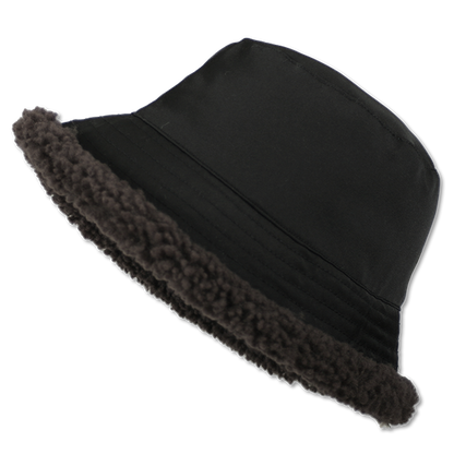 Elevate your winter style with our reversible Chestnut/Black Shearling Curly Wool Bucket Hat. Crafted from luxurious shearling and nylon with topstitching, this designer accessory offers versatility and warmth. Embrace premium quality and sophistication while staying cozy in chilly weather. A must-have addition to your cold-weather wardrobe.