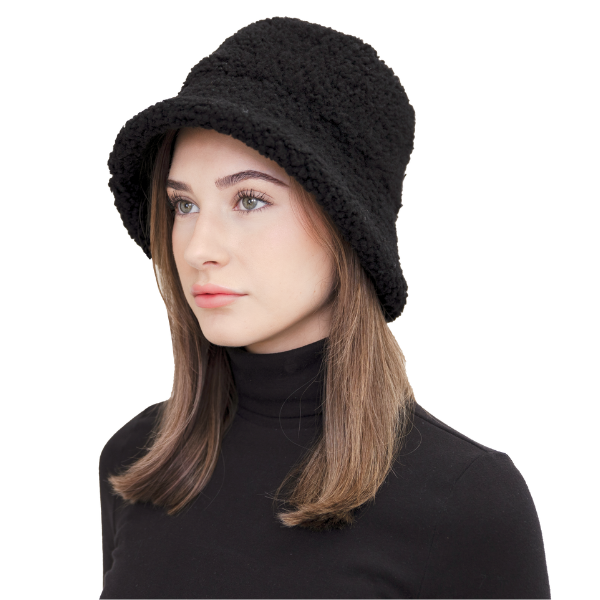 Elevate winter style with our reversible Black Shearling Curly Wool Bucket Hat. Crafted from luxurious shearling and wool, it reverses to durable nylon with topstitching for versatility. Stay warm and stylish with this designer accessory, perfect for cold-weather adventures. Embrace premium quality and fashion-forward design this winter.