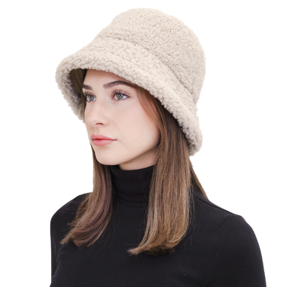 Elevate your winter style with our reversible shearling curly wool bucket hat in cement/beige, also reversible to nylon with topstitching. This designer accessory offers warmth, versatility, and premium craftsmanship. Stay cozy and chic all season long with this must-have addition to your cold-weather wardrobe.