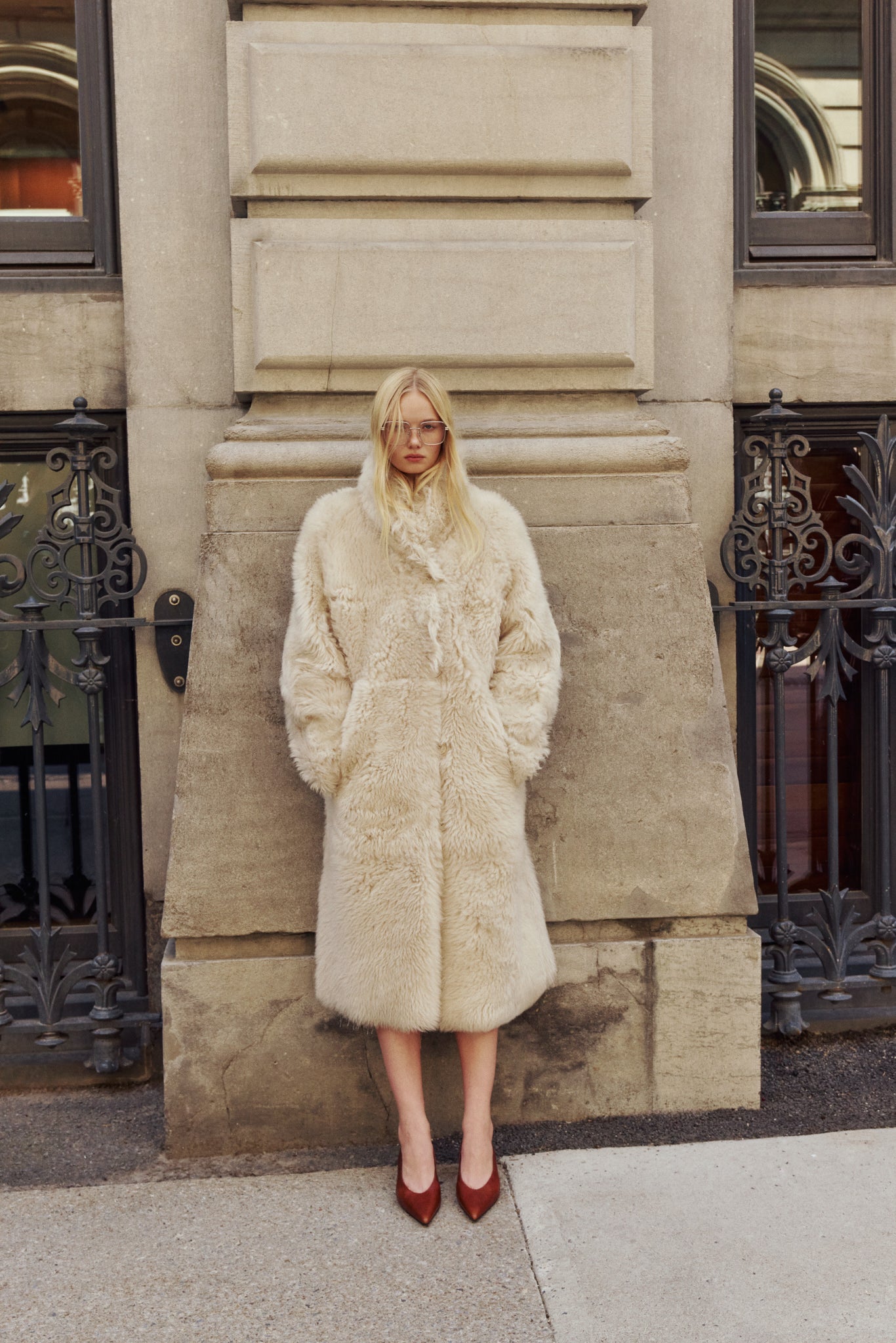 OMEGA introduces an element of understated luxury to cold-weather dressing, offering a longline silhouette engineered for seasonal transition. This exquisite investment outerwear piece pairs a deep suede exterior skin with a rich, magnificent semi curly toscana wool teddy on the reverse side. Designed to shift seamlessly from a dramatic, texture-forward profile to a classic, minimalist skin-out aesthetic, this fully reversible coat adapts effortlessly to your outfit. The oversized fit when worn wool-