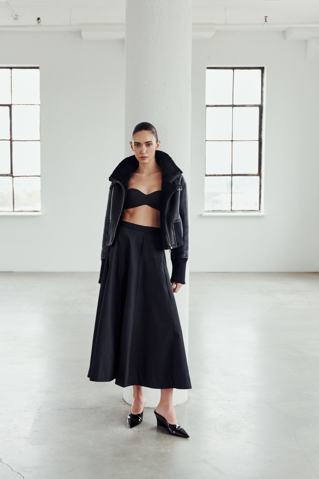 The CAVALLO delivers sharp alpine chic tailored for a metropolitan winter. This bomber jacket pairs rich brown matte nappa leather with a plush cream curly wool interior. Featuring integrated ribbed knit trim and a bold buckled collar, the cropped silhouette balances high-fashion utility with quiet luxury. Ideal for effortless layering, it moves easily from casual streetwear to an upscale cold-weather destination.