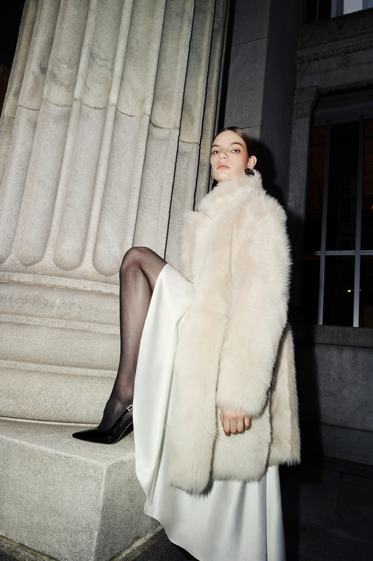 Indulge in the luxurious feel of this wool-out coat. This plush outerwear piece offers exceptional warmth and style. Designed with regular shoulders and a convenient snap closure, this jacket provides a comfortable fit. Practical slash pockets and interior zip pockets add functionality to this elegant shearling wool coat. A perfect addition to your collection of fine coats.