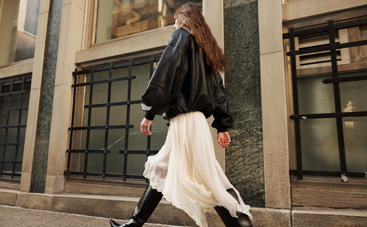 The Realm Black Leather Anorak Jacket is a modern interpretation of the classic anorak, elevated in luxury leather for a bold yet versatile statement. Designed with an oversized silhouette, it features a structured funnel neck collar and a concealed half-zip placket with gunmetal snap closures. Voluminous balloon sleeves and a cinched hem bring sculptural dimension, while functional flap pockets add everyday utility. A fusion of designer craftsmanship and contemporary outerwear design