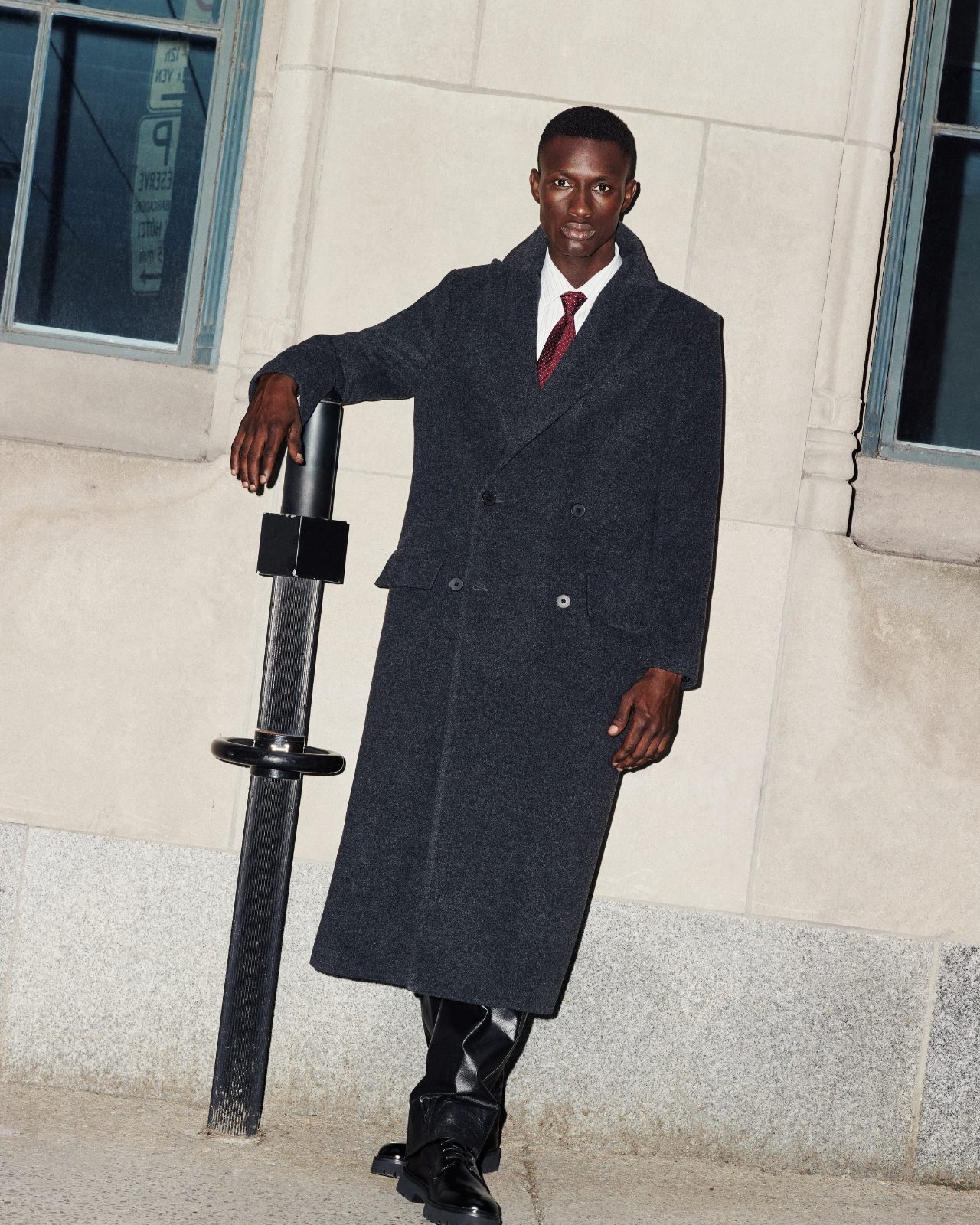 Step out in style with this Italian wool blend coat. This double-breasted outerwear piece is semi-fitted through the shoulders and arms, offering a relaxed fit through the torso. The spread collar and back belt detail add sophisticated touches to this jacket. Complete with a back vent and practical flap pockets, this wool coat is a timeless addition to your wardrobe.