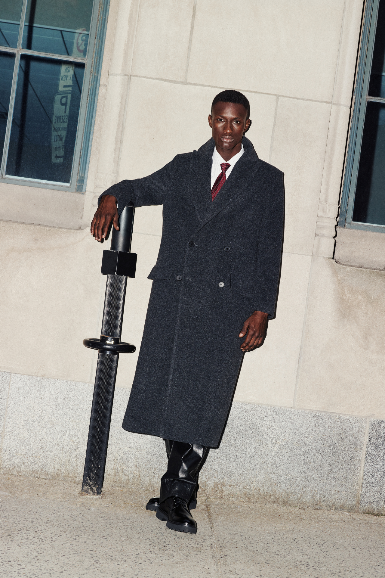 Step out in style with this Italian wool blend coat. This double-breasted outerwear piece is semi-fitted through the shoulders and arms, offering a relaxed fit through the torso. The spread collar and back belt detail add sophisticated touches to this jacket. Complete with a back vent and practical flap pockets, this wool coat is a timeless addition to your wardrobe.