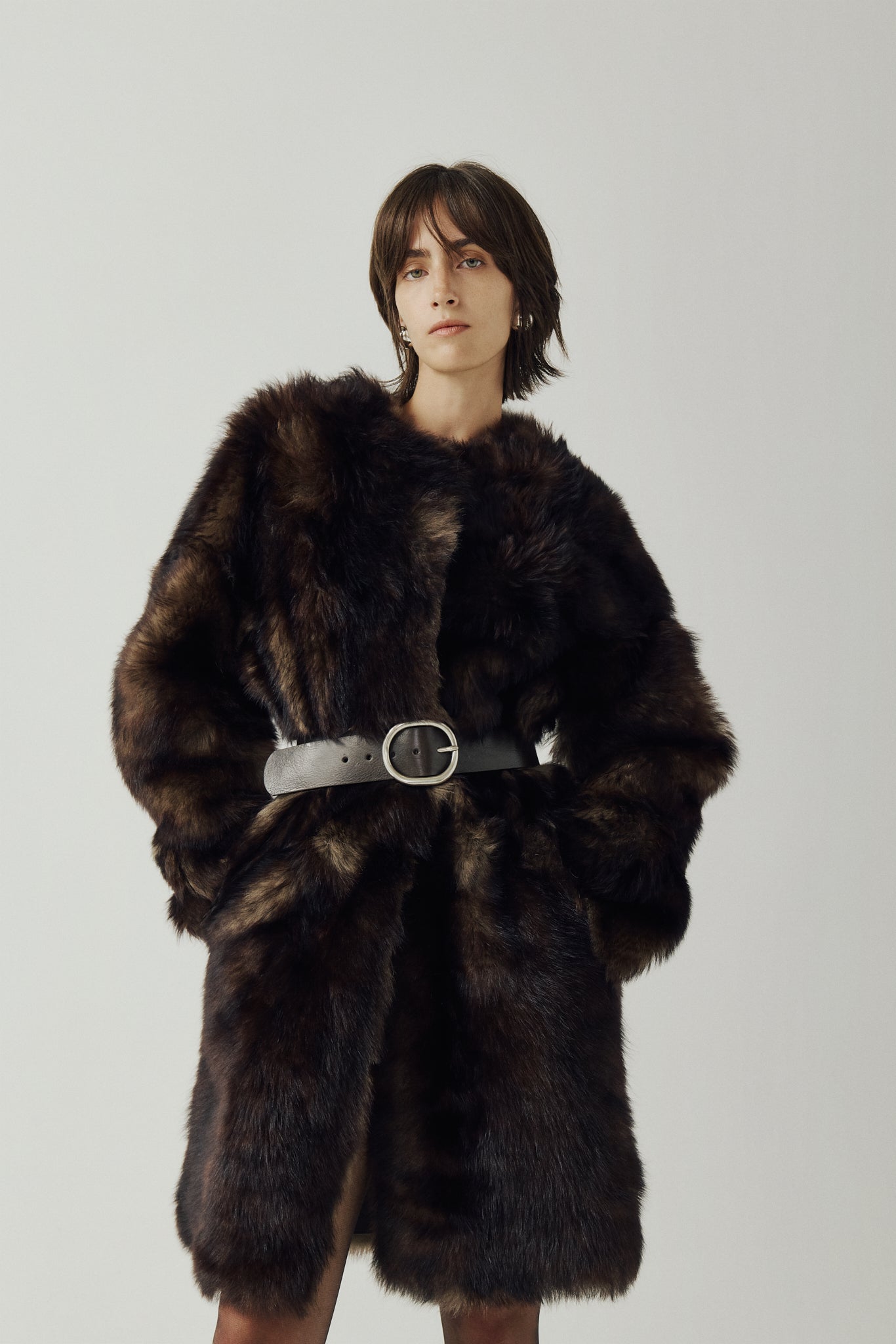 The ALLORA Jacket is a luxury reversible shearling teddy crafted in wolf Toscana for a rich and modern finish. Designed as a collarless oversized silhouette, it effortlessly flips from plush wool-out shearling to a sleek nappa skin-out jacket, offering two looks in one. With its generous fit through the shoulders, arms, and torso, ALLORA balances comfort and style. Functional slash side pockets on both sides and a front snap closure complete this elevated women’s reversible shearling jacket.