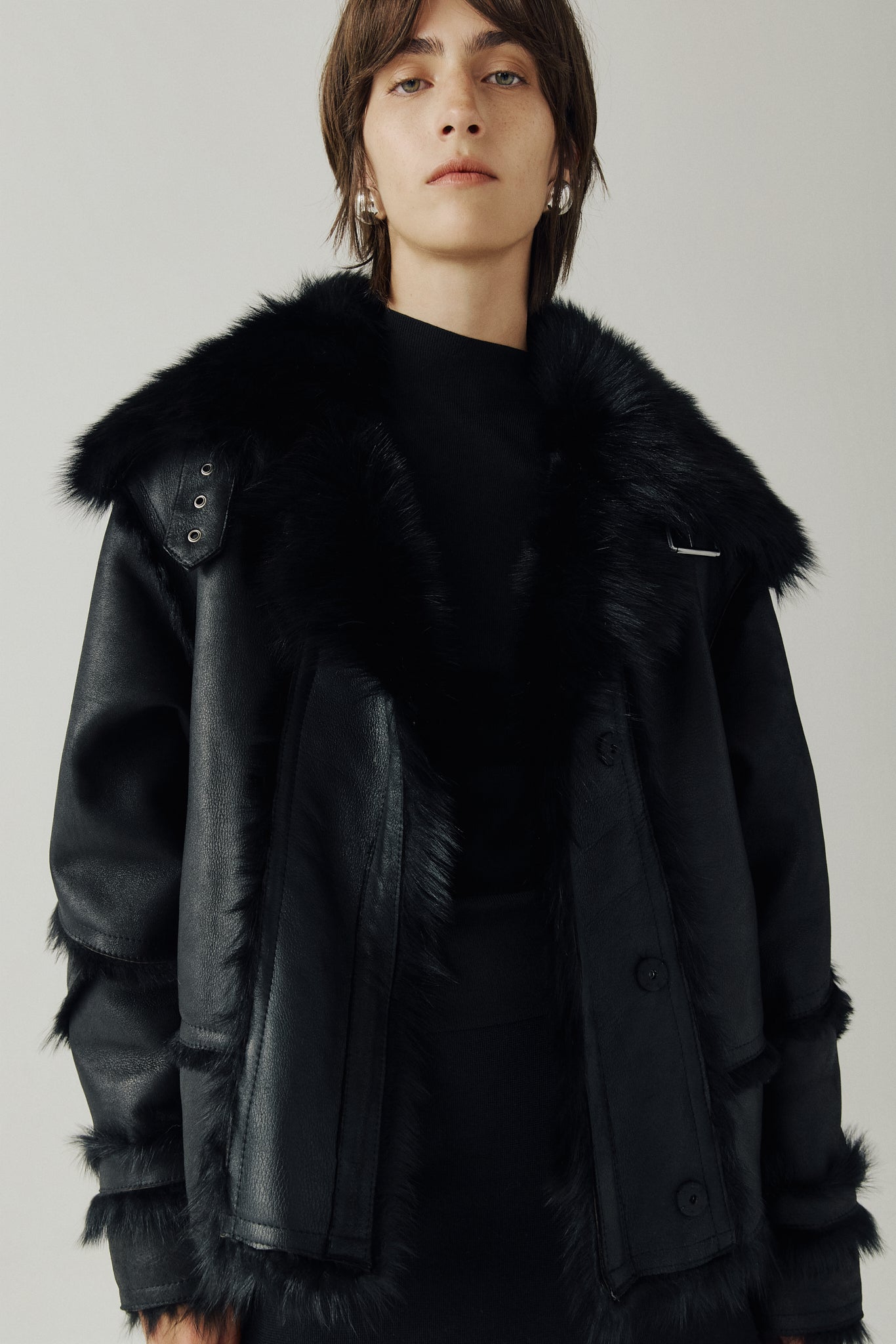 The VENUS Moto Shearling Jacket is a modern interpretation of the classic moto, crafted in supple nappa leather with Toscana wool-out seam detailing. Its drop-shoulder silhouette adds effortless ease, while the spread Toscana collar with buckle detail delivers a bold, statement finish. Designed for both form and function, VENUS features interior and exterior zip pockets to secure essentials. A front snap closure completes this sleek, cold-weather essential with understated edge.