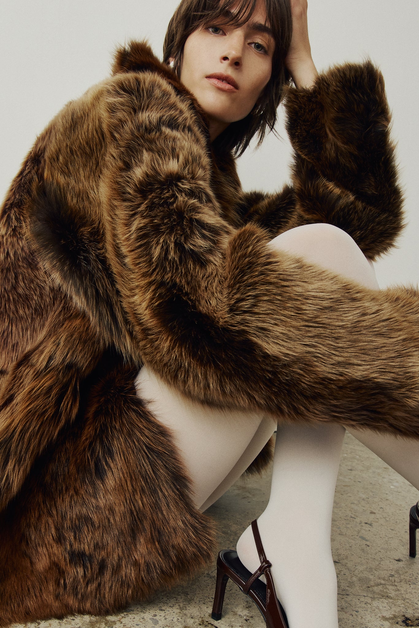 The MILKY WAY Jacket is a versatile statement piece crafted in macassar nappa shearling, designed as a reversible teddy that flips to a nappa skin-out jacket. It offers a relaxed fit when worn wool-out and a regular fit when worn skin-out. A spread collar adds structure, while slash side pockets on the teddy side and patch side pockets on the nappa side provide functionality. Finished with a front button closure, MILKY WAY combines plush texture with sleek nappa styling for modern cold-weather versatility.