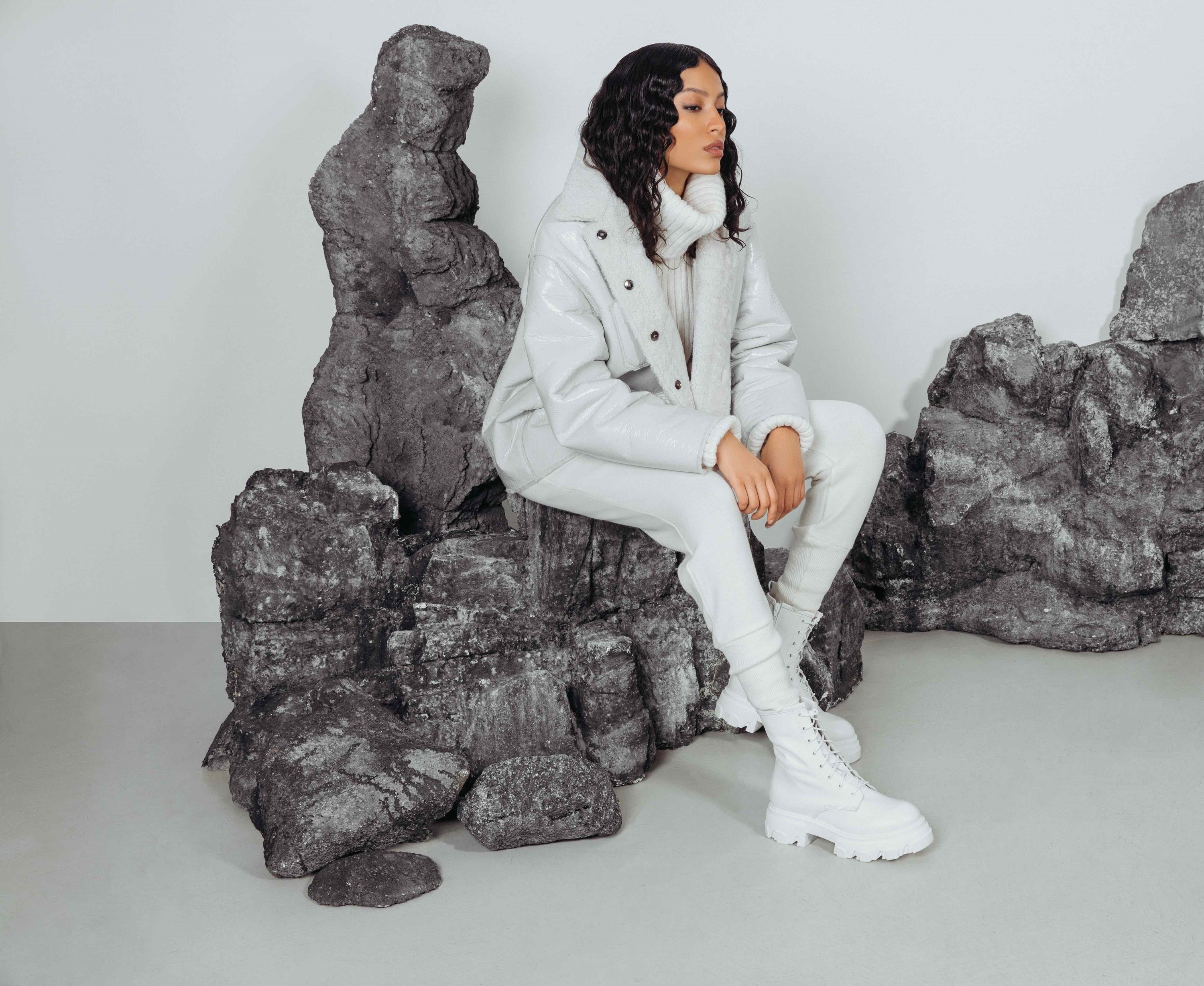 Moxy: WHITE GLOSSY CURLY. Shearling. Reversible. Dropped shoulder and loose sleeves. Designed for a loose fit through frame with a boxy cut. Styled after the French bleu de travail or Chore jacket. 26 in