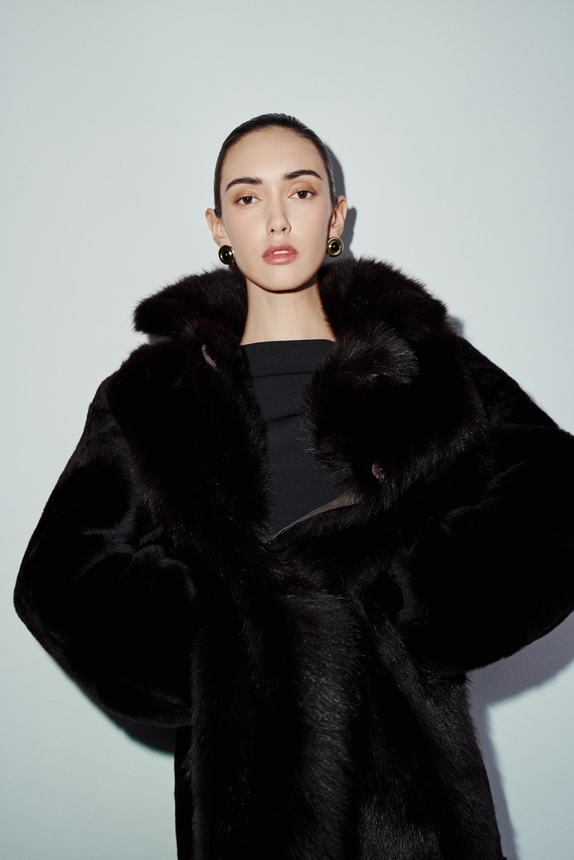 The MAEVE Coat is a heritage-inspired reversible outerwear piece crafted in chocolate&nbsp;suede and Toscana rasado teddy. Designed to flip seamlessly from plush wool-out to sleek suede skin-out, it offers versatile styling for both everyday wear and après-ski sophistication. A drop shoulder provides ease of movement, while the fit adapts—regular when worn wool-out and semi-fitted when worn skin-out. An oversized Toscana wool notch collar, slash pockets on the teddy side, and single welt pockets on suede