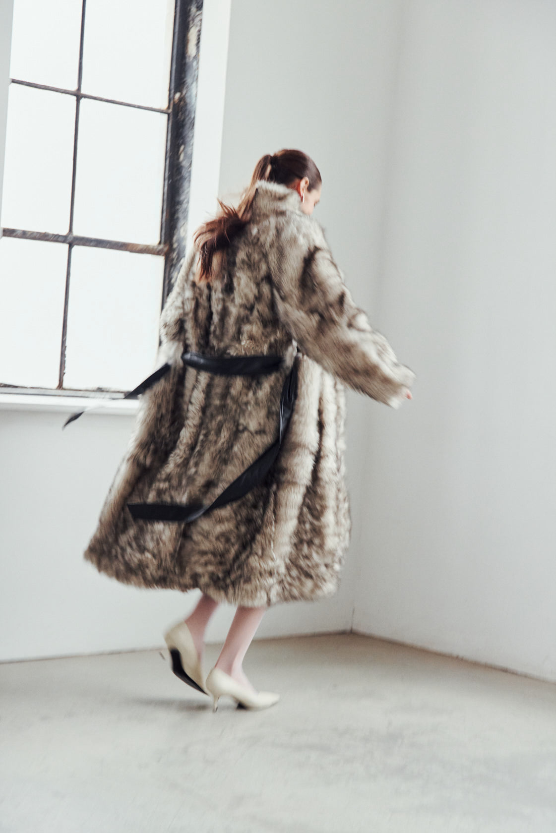 The MAGIK Coat is a heritage-inspired reversible full-length shearling coat crafted in shadow nappa leather with plush short curly nodel wool teddy on the reverse. Designed for a relaxed-fit fit with drop shoulders, an exaggerated shawl collar, and a straight silhouette, MAGIK combines modern edge with timeless texture. Functional slash pockets on the wool side, clean patch pockets on the nappa side, and a front button closure make this coat as practical as it is versatile, perfect for après-ski layering 