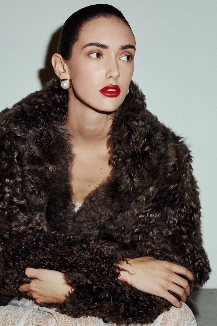 MILKY WAY redefines alpine chic with an understated, sophisticated aesthetic perfect for any cold-weather destination. This statement jacket seamlessly fuses suede with plush, toscana wool shearling for a striking textured contrast. The fully reversible design transitions effortlessly from a dramatic texture-forward look to a sleek, suede-dominant profile accented by an exaggerated plush collar. Its mid-length silhouette flatters the form while maintaining effortless comfort. 