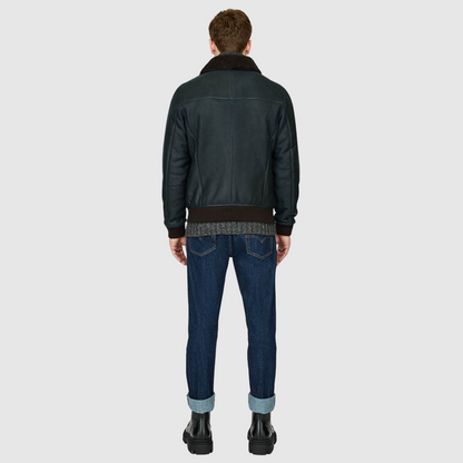 Nappa bomber with curly wool collar Fits true to size Rib cuffs and waistband Standard zip closure Zip pockets Interior zip pocket