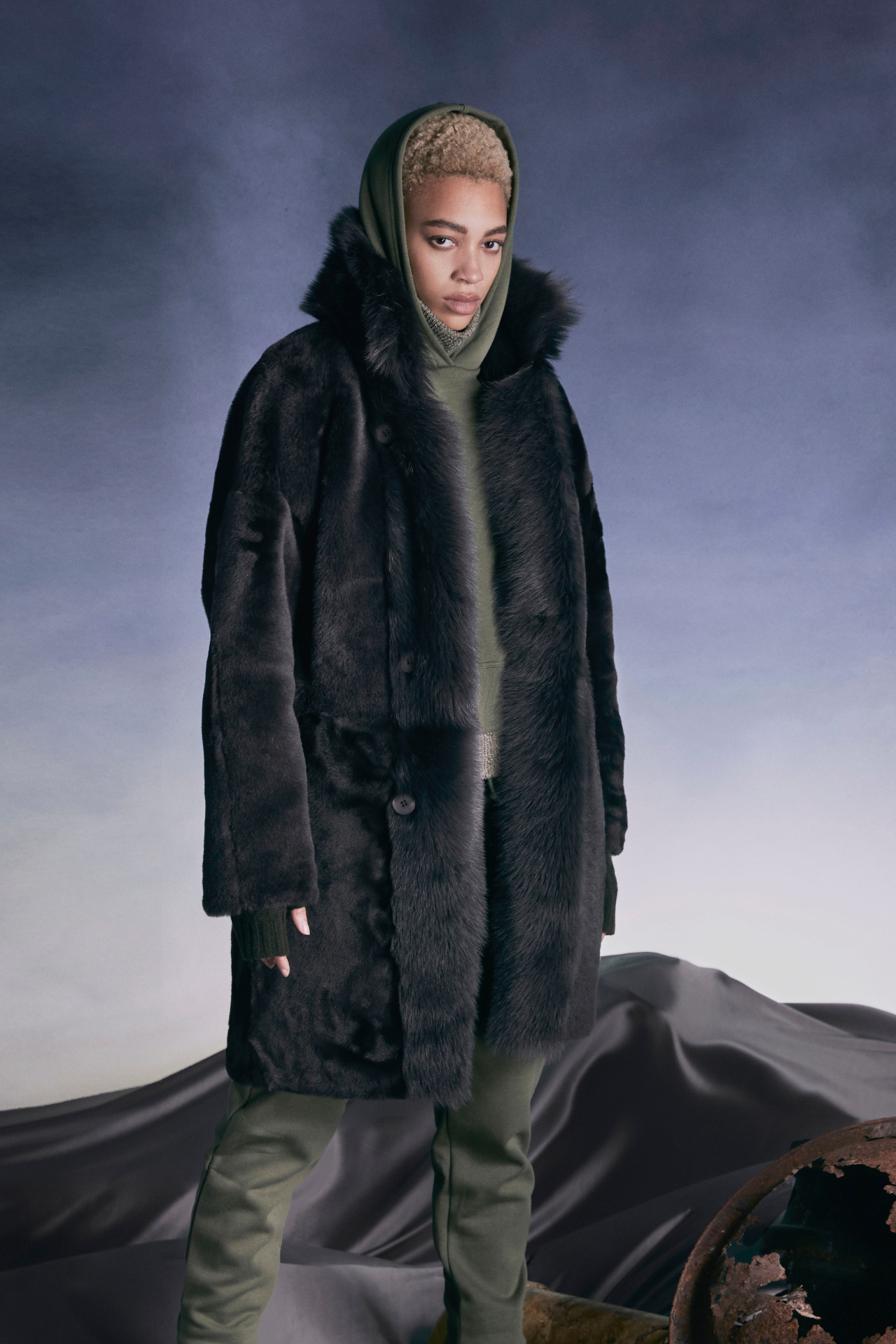 August Cappuccino Suede Shearling Coat: Crafted for winter elegance, this luxurious outerwear piece seamlessly blends style and warmth. The sumptuous toscana rasado shearling lining ensures cozy comfort, while the reversible design adds versatility. With a relaxed kimono armhole, dropped shoulder, and generous sleeves, it’s perfect for layering. The loose-fit silhouette drapes beautifully, and at 36 inches long, it provides ample coverage. Elevate your winter wardrobe with this timeless statement piece!