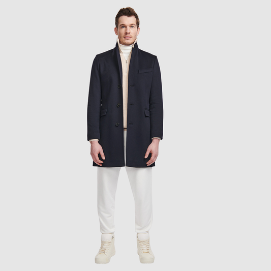 The Dylan Loro Piana Wool Coat captures refined sophistication through meticulous tailoring and Italian craftsmanship. Made from Loro Piana superfine wool, this single-breasted coat offers a slim fit through the arms and body, creating a sharp, modern silhouette ideal for both professional and evening wear. The notch collar, button-detailed cuffs, and flap side pockets add subtle sophistication, while the back vent ensures ease of movement and comfort. A single welt chest pocket completes this timeless look