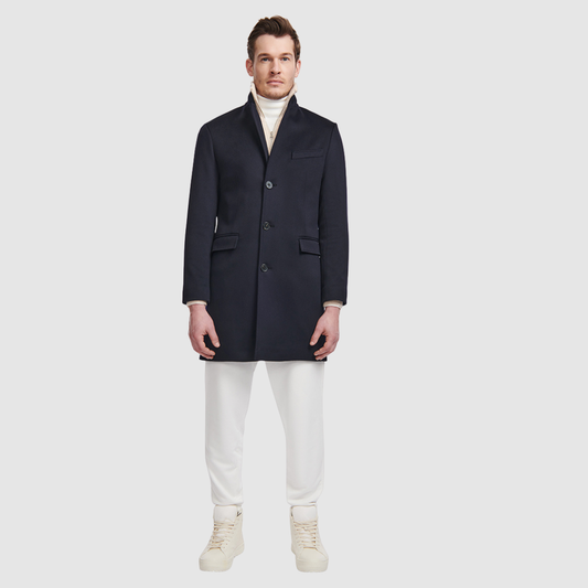 The Dylan Loro Piana Wool Coat captures refined sophistication through meticulous tailoring and Italian craftsmanship. Made from Loro Piana superfine wool, this single-breasted coat offers a slim fit through the arms and body, creating a sharp, modern silhouette ideal for both professional and evening wear. The notch collar, button-detailed cuffs, and flap side pockets add subtle sophistication, while the back vent ensures ease of movement and comfort. A single welt chest pocket completes this timeless look