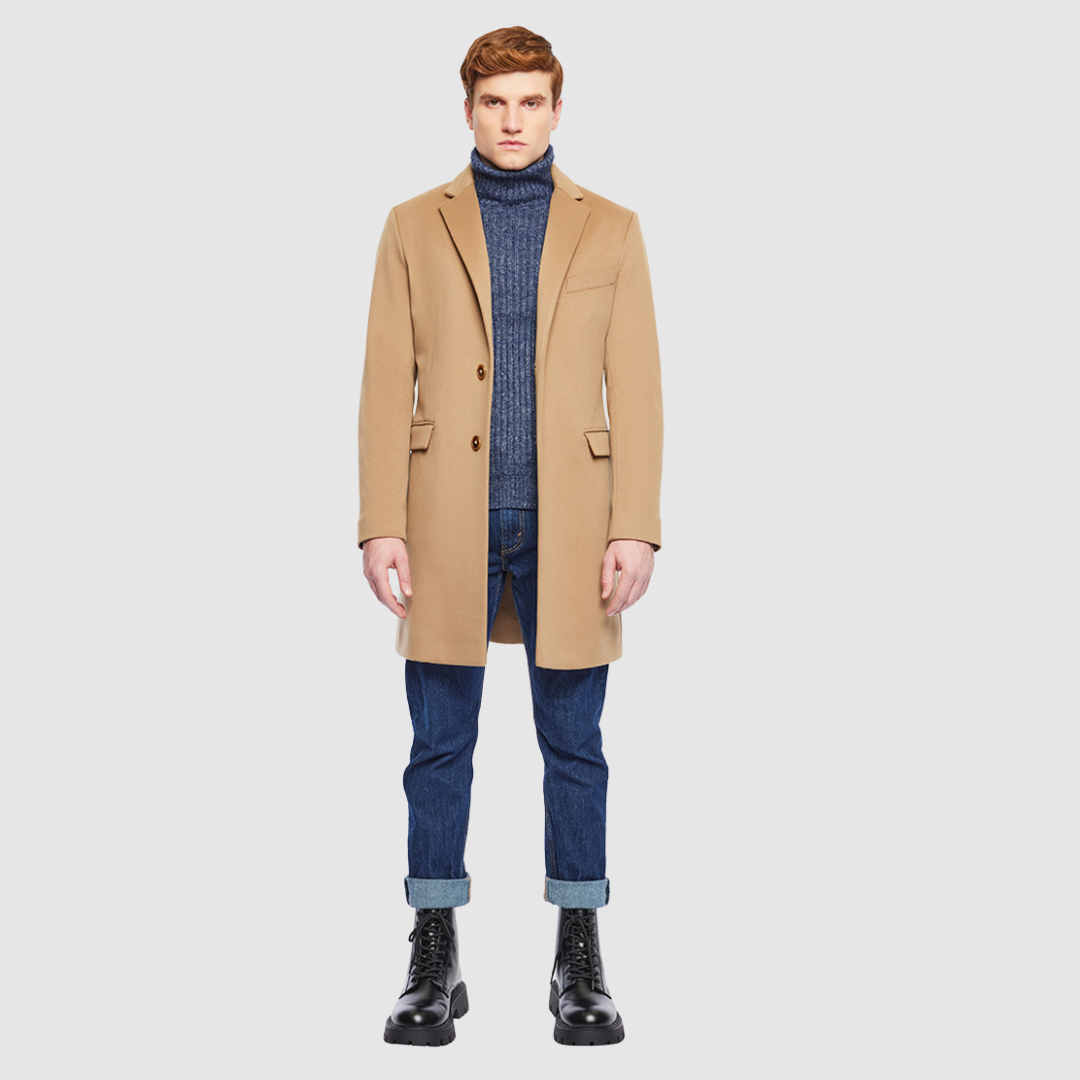 The Dylan Camel Loro Piana Wool Coat captures refined sophistication through meticulous tailoring and Italian craftsmanship. Made from Loro Piana superfine wool, this single-breasted coat offers a slim fit through the arms and body, creating a sharp, modern silhouette ideal for both professional and evening wear. The notch collar, button-detailed cuffs, and flap side pockets add subtle sophistication, while the back vent ensures ease of movement and comfort. A single welt chest pocket completes this timeles
