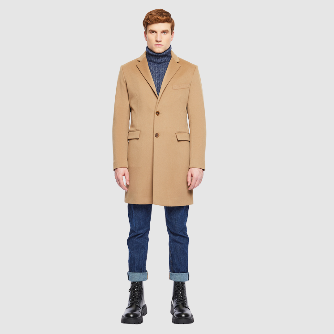 The Dylan Camel Loro Piana Wool Coat captures refined sophistication through meticulous tailoring and Italian craftsmanship. Made from Loro Piana superfine wool, this single-breasted coat offers a slim fit through the arms and body, creating a sharp, modern silhouette ideal for both professional and evening wear. The notch collar, button-detailed cuffs, and flap side pockets add subtle sophistication, while the back vent ensures ease of movement and comfort. A single welt chest pocket completes this timeles