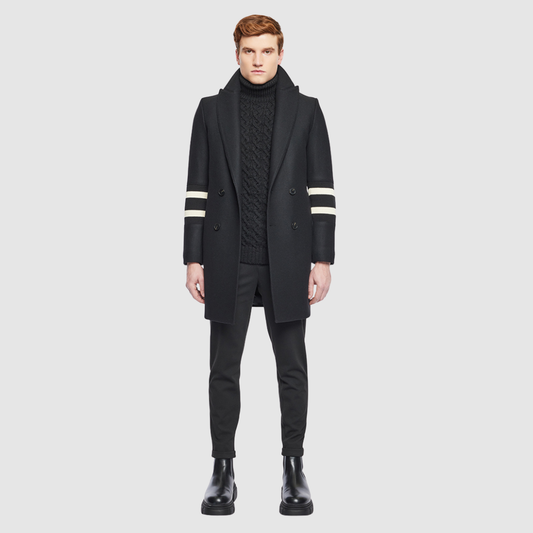 The Sebastian Black Wool Rugby Coat is a tailored Italian wool cashmere blend jacket designed for refined cold-weather style. Featuring regular shoulders and a fitted cut through the arms and chest, it offers a structured silhouette that balances classic tailoring with modern menswear appeal. Details like the spread collar, knit stripe accents on the sleeves, and single welt pockets provide a subtle, heritage-inspired touch. Single-breasted button closure ensures clean lines, make Sebastian ideal for layers