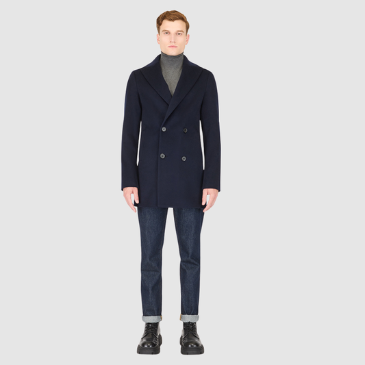 The David Navy Loro Piana Wool Jacket embodies timeless sophistication and precision tailoring. Crafted from Loro Piana superfine wool, this double-breasted jacket offers a refined structure and a luxurious hand-feel that elevates any modern wardrobe. Designed with a regular shoulder and a fitted silhouette through the arms and body, it delivers a sharp, polished profile. The peak lapel collar, back vent, and single welt pockets underscore its heritage-inspired craftsmanship, merging Italian elegance with c