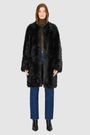 The ALLORA Jacket is a luxury reversible shearling teddy crafted in Jet Toscana for a rich and modern finish. Designed as a collarless regular fit silhouette, it effortlessly flips from plush wool-out shearling to a sleek nappa skin-out jacket, offering two looks in one. With its generous fit through the shoulders, arms, and torso, ALLORA balances comfort and style. Functional slash side pockets on both sides and a front snap closure complete this elevated women’s reversible shearling jacket.