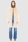 The ALLORA Jacket is a luxury reversible shearling teddy crafted in parchment toscana for a rich and modern finish. Designed as a collarless regular fitting silhouette, it effortlessly flips from plush wool-out shearling to a sleek suede skin-out jacket, offering two looks in one. With its generous fit through the shoulders, arms, and torso, ALLORA balances comfort and style. Functional slash side pockets on both sides and a front snap closure complete this elevated women’s reversible shearling jacket.