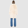 The ALLORA Jacket is a luxury reversible shearling teddy crafted in parchment toscana for a rich and modern finish. Designed as a collarless regular fitting silhouette, it effortlessly flips from plush wool-out shearling to a sleek suede skin-out jacket, offering two looks in one. With its generous fit through the shoulders, arms, and torso, ALLORA balances comfort and style. Functional slash side pockets on both sides and a front snap closure complete this elevated women’s reversible shearling jacket.