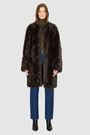The ALLORA Jacket is a luxury reversible shearling teddy crafted in carbon toscana for a rich and modern finish. Designed as a collarless regular fit silhouette, it effortlessly flips from plush wool-out shearling to a sleek nappa skin-out jacket, offering two looks in one. With its generous fit through the shoulders, arms, and torso, ALLORA balances comfort and style. Functional slash side pockets on both sides and a front snap closure complete this elevated women’s reversible shearling jacket.