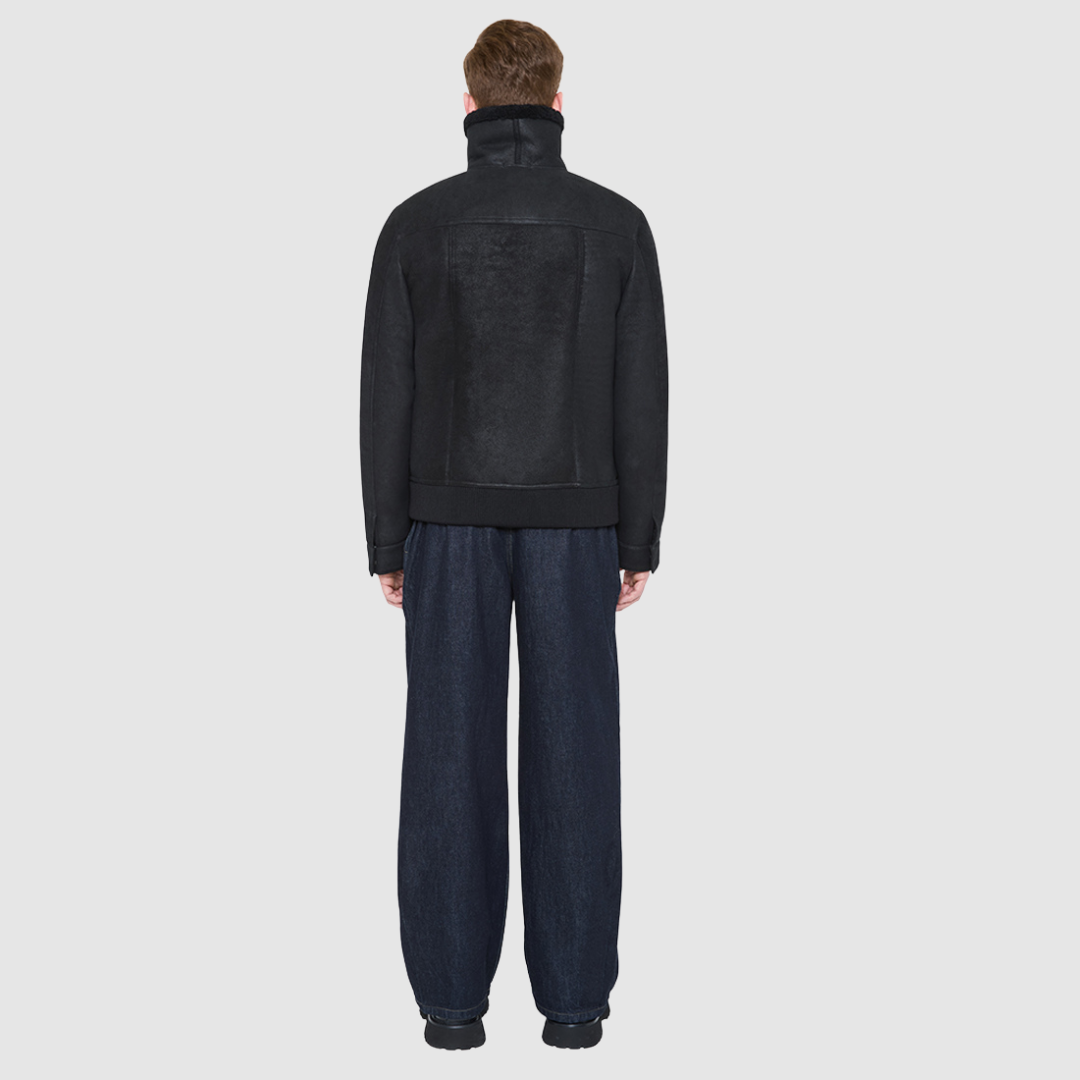 Man wearing the Aries Jet Mojito Shearling Bomber Jacket, a luxury winter coat featuring a structured silhouette.