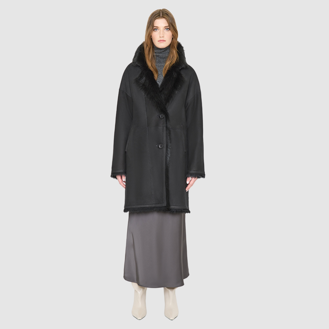 AUGUST is a heritage-inspired reversible medium-length coat crafted with a suede and toscana shearling combination. Designed for a relaxed silhouette with drop shoulders, an exaggerated notched collar with plush trim, and a straight fit, AUGUST combines modern edge with timeless texture. Functional slash pockets on the wool side, clean welt pockets on the nappa side, and a front button closure make this coat as practical as it is versatile, perfect for après-ski layering or elevated city styling.
