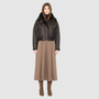 The CLARITY shearling bomber jacket offers a modern take on the classic bomber jacket, combining rugged function with luxurious texture. Crafted in a rich chocolate brown nappa leather and plush, dark rasado shearling wool interior, it delivers an elevated cold-weather look. Designed with a drop shoulder and a high shearling collar, it balances structure with relaxed ease. A tonal ribbed knit waistband, structural paneling, and clean hardware details lend utility to this elegant semi-fitted style