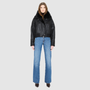 The CLARITY shearling bomber jacket offers a modern take on the classic bomber jacket, combining rugged function with luxurious texture. Crafted in a rich jet black nappa leather and plush, dark rasado shearling wool interior, it delivers an elevated cold-weather look. Designed with a drop shoulder and a high shearling collar, it balances structure with relaxed ease. A tonal ribbed knit waistband, structural paneling, and clean hardware details lend utility to this elegant semi-fitted style