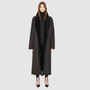 The DANIELLE Duster is a statement in heritage-inspired luxury and modern versatility. Crafted in java semi suede leather and plush curly wool shearling, this reversible oversized coat transitions effortlessly from sleek leather to cozy teddy texture. Its elongated silhouette is enhanced with a slight drop shoulder, back vent, and double-breasted button closure, creating timeless elegance with functional edge. Practical single welt pockets on the semi suede side and slash pockets on the wool side