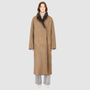 The DANIELLE Duster is a statement in heritage-inspired luxury and modern versatility. Crafted in kangaroo suede leather and plush curly wool shearling, this reversible oversized coat transitions effortlessly from sleek leather to cozy teddy texture. Its elongated silhouette is enhanced with a slight drop shoulder, back vent, and double-breasted button closure, creating timeless elegance with functional edge. Practical single welt pockets on the suede side and slash pockets on the wool side.