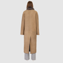 The DANIELLE Duster is a statement in heritage-inspired luxury and modern versatility. Crafted in kangaroo suede leather and plush curly wool shearling, this reversible oversized coat transitions effortlessly from sleek leather to cozy teddy texture. Its elongated silhouette is enhanced with a slight drop shoulder, back vent, and double-breasted button closure, creating timeless elegance with functional edge. Practical single welt pockets on the suede side and slash pockets on the wool side.