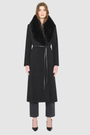 Model wearing an ESTELLE Black Wool Coat with plush shearling collar, perfect for warm winter layers and luxury coats.